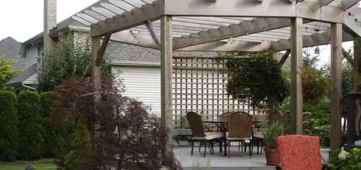 outdoor entertainment space design and installation Lifestyle Landscaping pergola with dining table